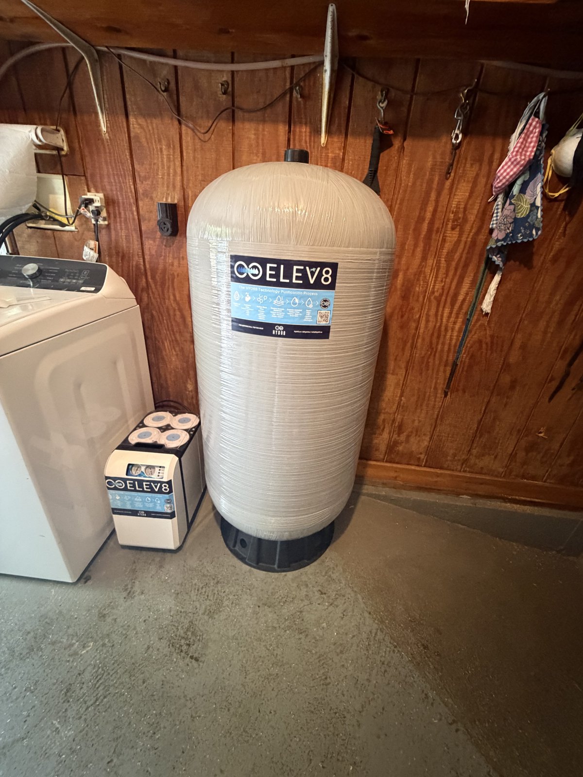 ELEV8-branded reverse osmosis tank with purification process label